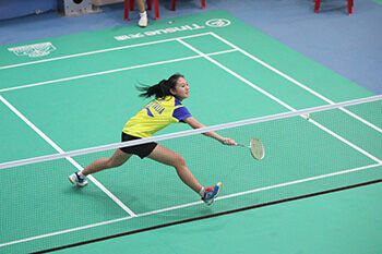 Woman playing badminton